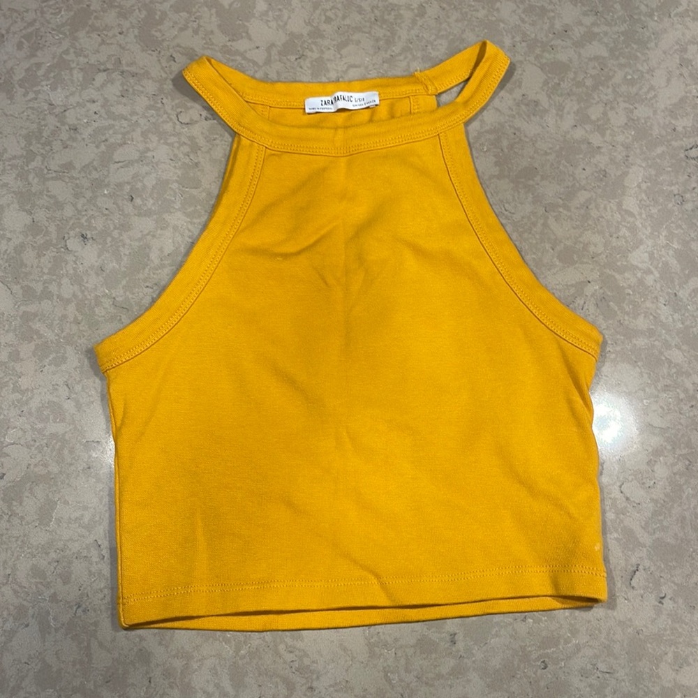 Sleeveless cropped shirt that’s not too tight and very flattering.